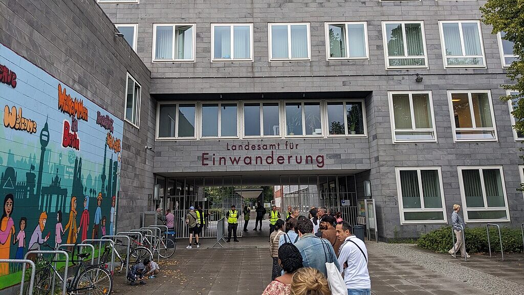 long line of people waiting to get into the Berlin immigration office