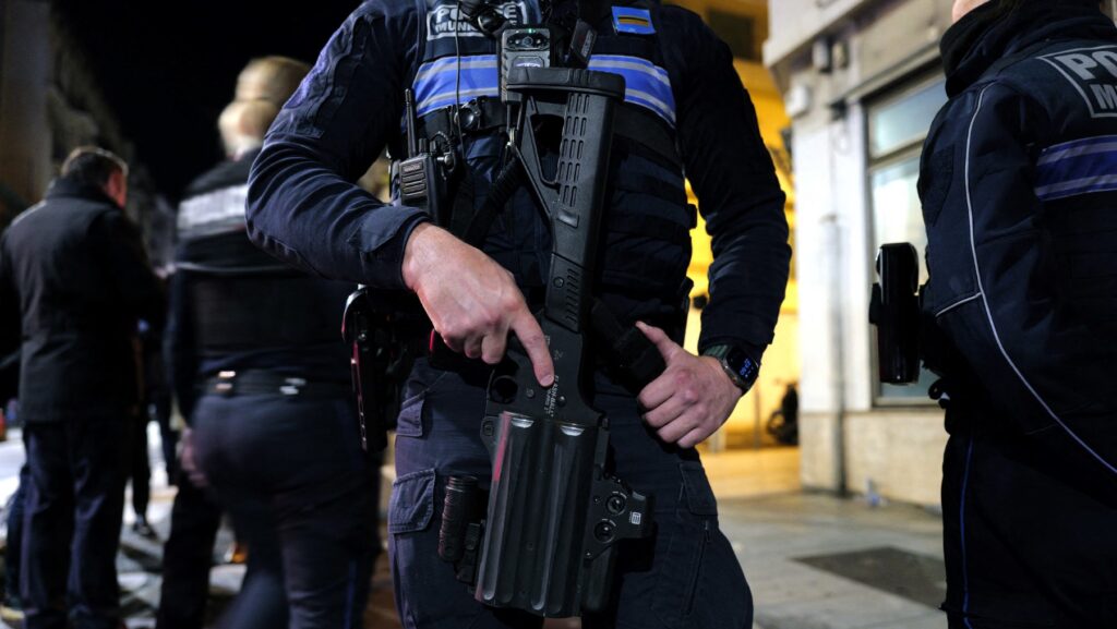Heavily armed police with bullet proof vests.