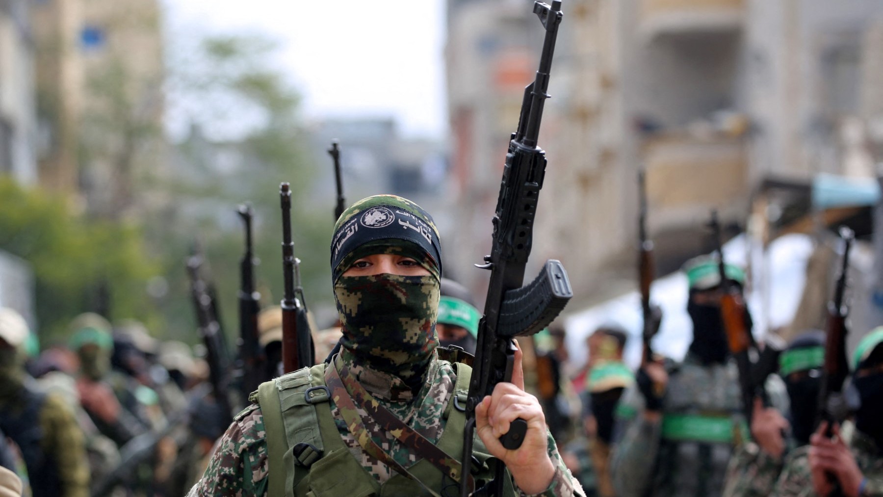 Ezzedine al-Qassam Brigades members take part in the funeral procession of Marwan Issa, a top Hamas commander killed in March 2024, in the Gaza Strip on February 7, 2025.