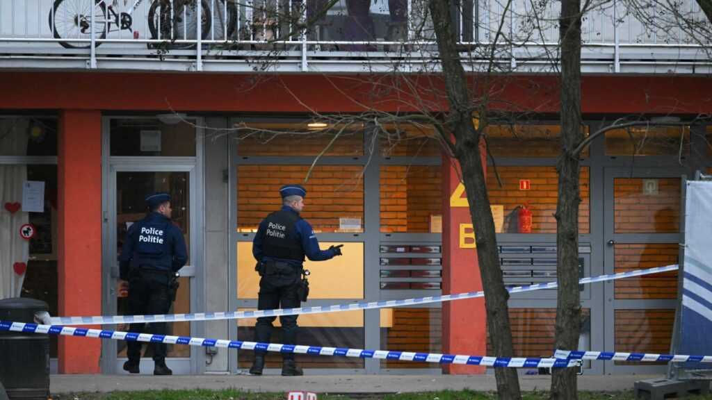 Police officers in the cité du Peterbos neighbourhood of Anderlecht, Brussels, where a man was killed in a new shooting linked to drug trafficking, on February 7, 2025.