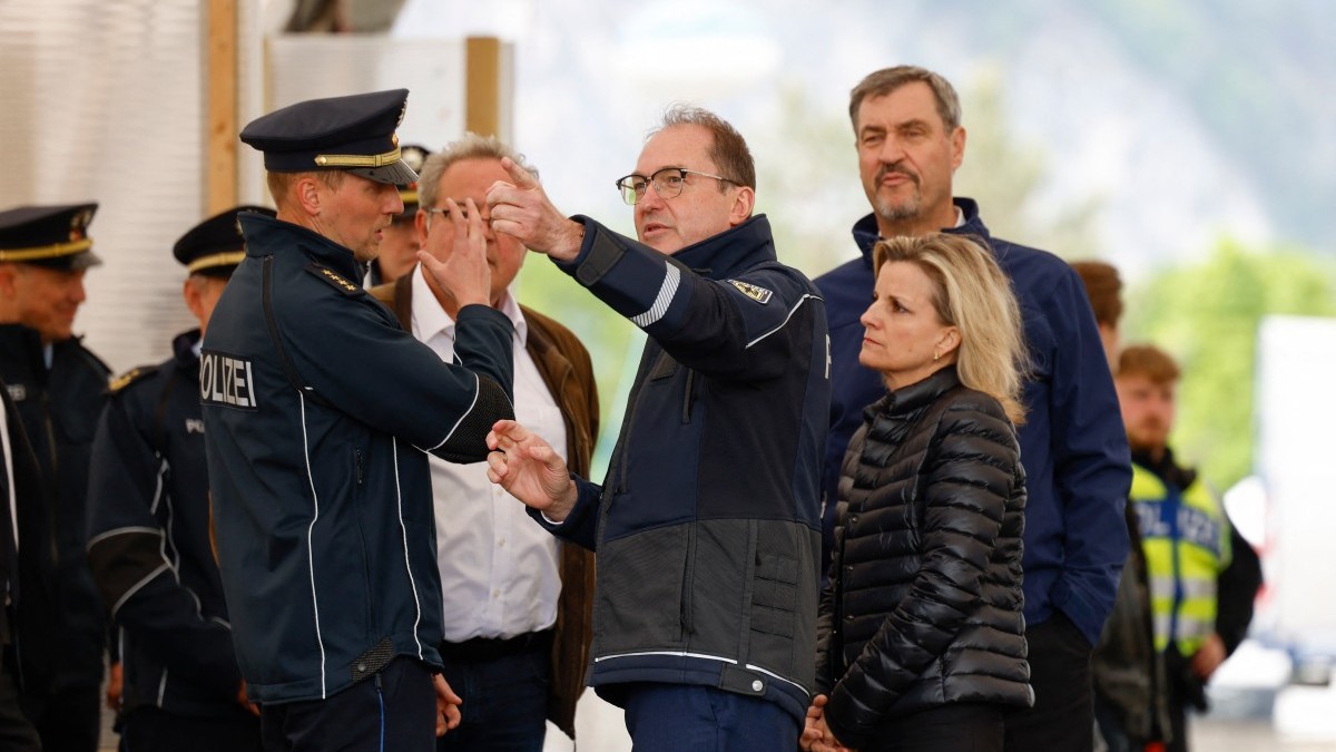 German Interior Minister Alexander Dobrindt (C) and Bavarian Prime Minister Markus Söder (R) visit the border control station Kiefersfelden, southern Germany, on May 15, 2025.