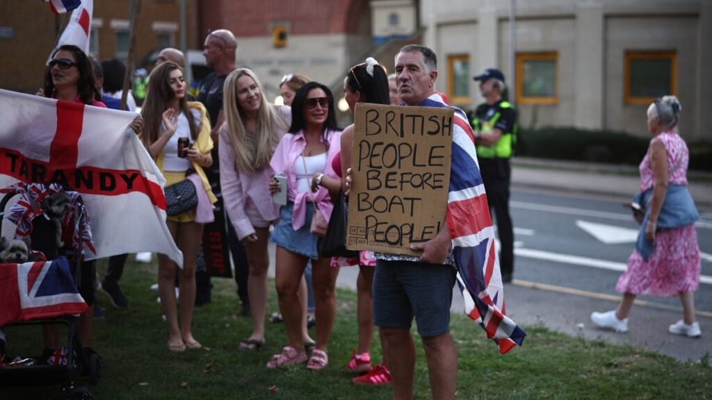 Protesters calling for the closure of the The Bell Hotel that housed asylum seekers gather outside the council offices in Epping, England on August 8, 2025.