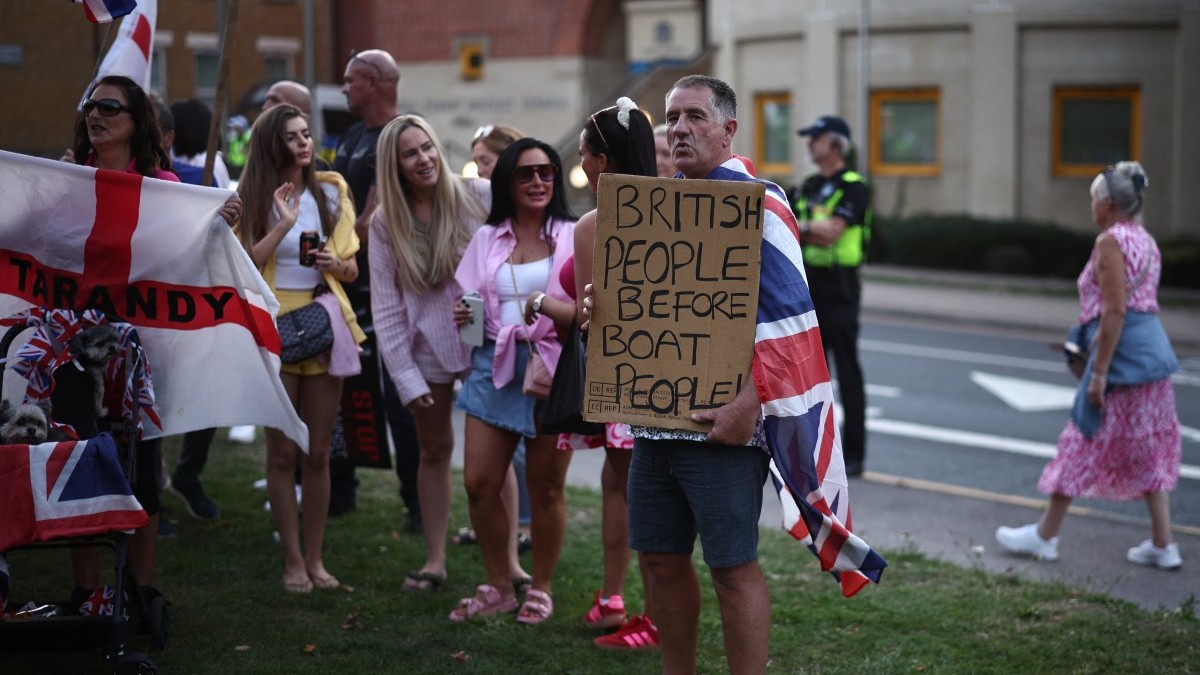 Protesters calling for the closure of the The Bell Hotel that housed asylum seekers gather outside the council offices in Epping, England on August 8, 2025.