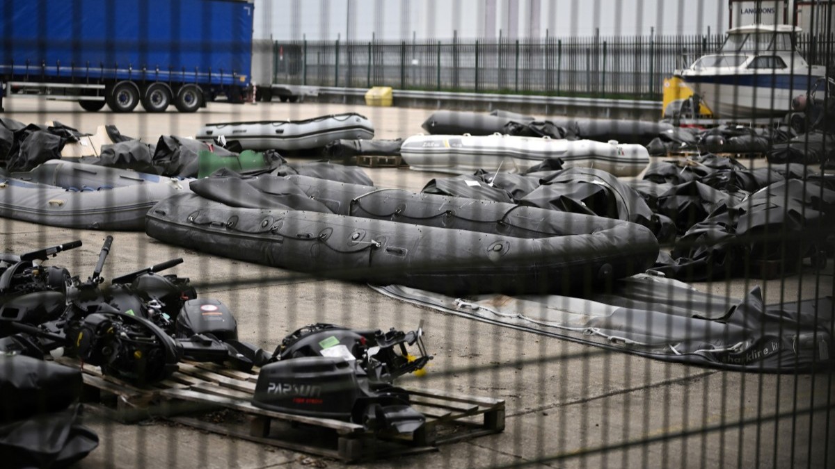 Inflatable dinghies and outboard engines, used by migrants attempting to cross the English Channel from France, are pictured in storage at a Port Authority yard in Dover, England, on May 21, 2025.