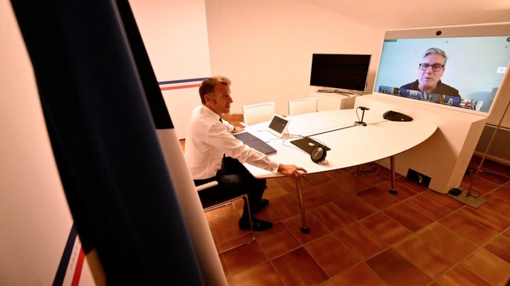 Emmanuel Macron talks with Keir Starmer during a video meeting of the ‘Coalition of the Willing’ to discuss next steps for Ukraine on August 19, 2025.