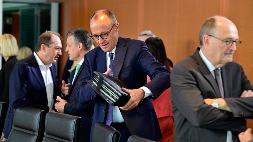 German Chancellor Friedrich Merz (C) arrives for the weekly meeting of the cabinet at the Chancellery in Berlin on August 6, 2025.