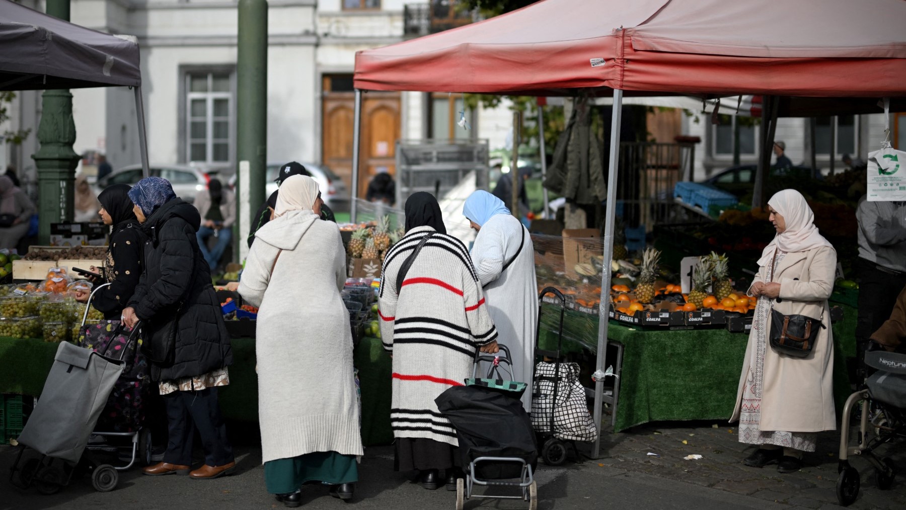 Shoppers at a market in the Molenbeek district of Brussels