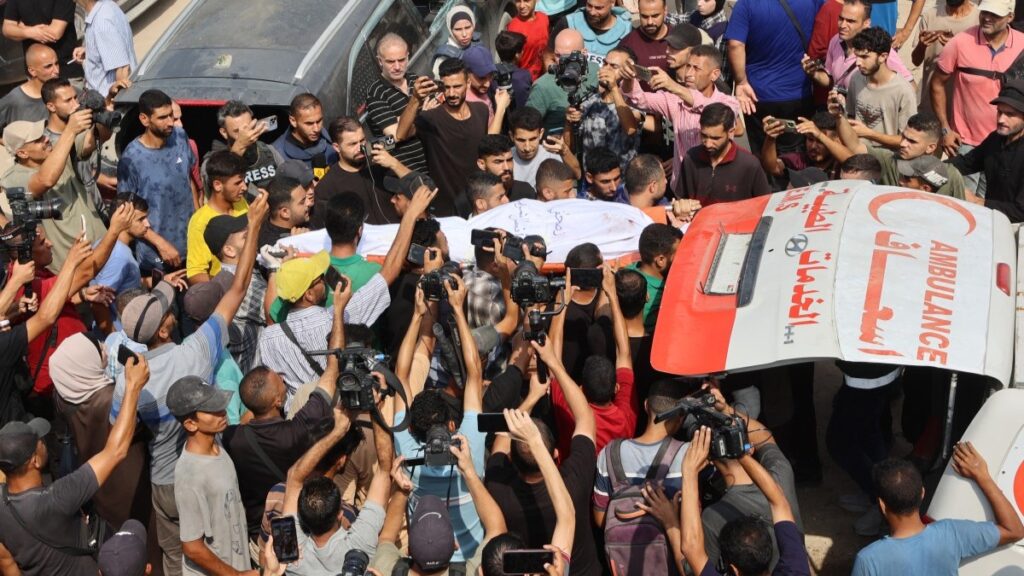 Mourners carry the body of Al Jazeera correspondent Anas al-Sharif, killed alongside other journalists in an overnight Israeli strike on their tent in Gaza City, during his funeral on August 11, 2025.