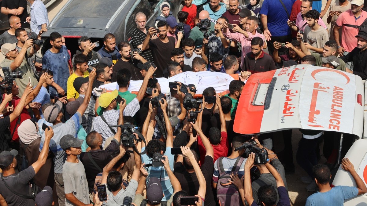 Mourners carry the body of Al Jazeera correspondent Anas al-Sharif, killed alongside other journalists in an overnight Israeli strike on their tent in Gaza City, during his funeral on August 11, 2025.