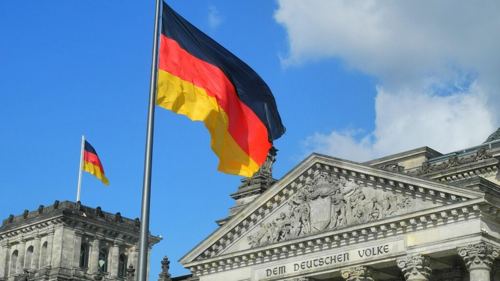 Reichstag building front with German flags