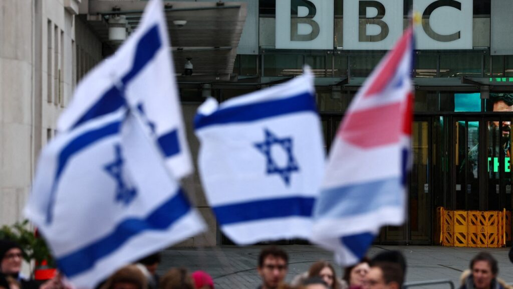 Protesters hold placards and wave Israeli flags as they take part in the demonstration ‘Rape is NOT resistance’ outside the BBC headquarters in London, on February 4, 2024.