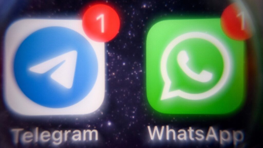 The logos of Telegram and WhatsApp seen on a smartphone screen in Moscow on August 13, 2025
