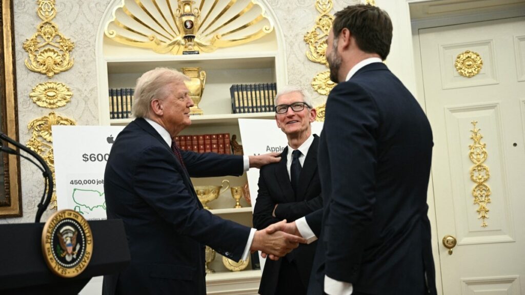 U.S. President Donald Trump shakes hands with Vice President JD Vance as Apple CEO Tim Cook looks on in the Oval Office of the White House in Washington, D.C., on August 6, 2025.