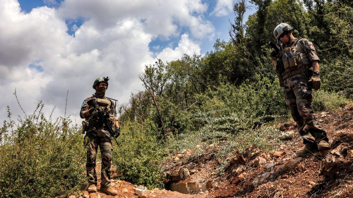 Peacekeepers of the United Nations Interim Force in Lebanon (UNIFIL) stand at a position formerly held Iran-backed Hezbollah in the Khraibeh Valley in el-Meri in south Lebanon on August 27, 2025.
