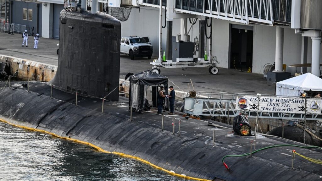 U.S. Navy personnel stand a top USS New Hampshire (SSN-778), a Virginia-class nuclear-powered attack submarine at Port Everglades in Fort Lauderdale, Florida, on April 29, 2025.