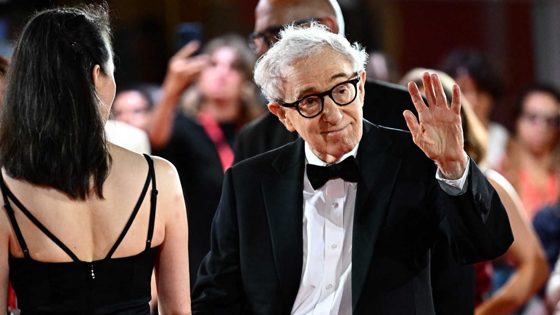 Woody Allen waves on the red carpet of the movie Coup de Chance presented out of competition at the 80th Venice Film Festival on September 4, 2023.