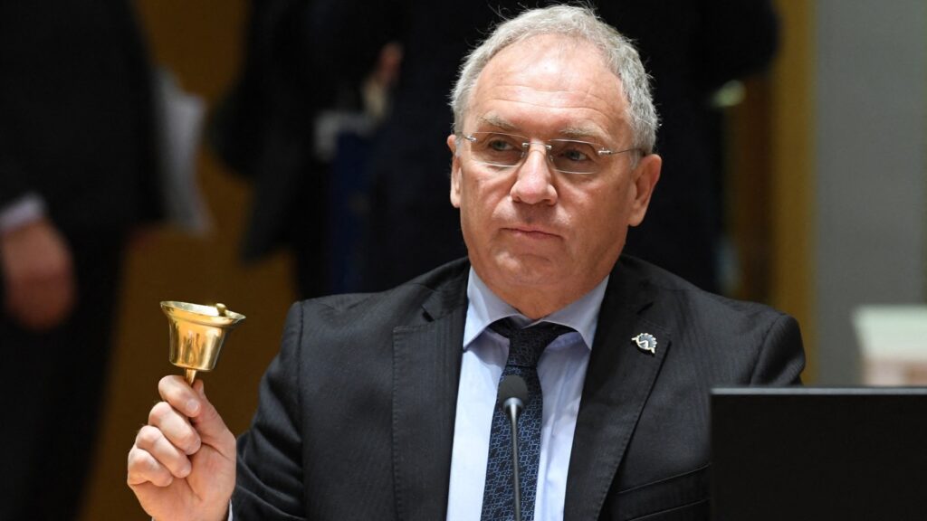 Slovenian Interior Minister Aleš Hojs rings the bell during Justice and Home Affairs Ministers council meeting at the EU headquarters in Brussels on December 9, 2021.