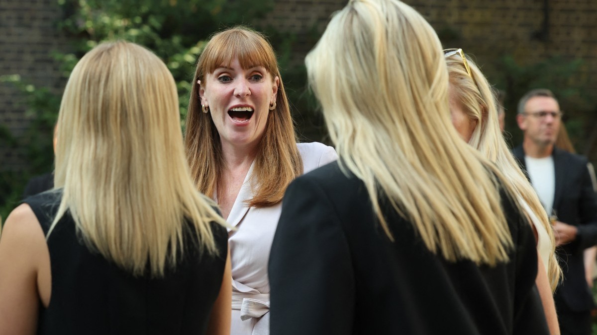 Britain’s Deputy Prime Minister Angela Rayner laughs as she talks with guests during a reception for the England Women's national football team in the garden at Downing Street in central London on July 28, 2025.