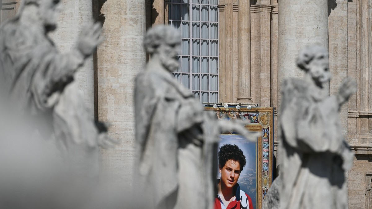 A portrait of late Italian teenager Carlo Acutis displayed on the facade of Saint Peter's Basilica during a Holy Mass and canonisation of Blessed Carlo Acutis and Pier Giorgio Frassati in St Peter's Square at the Vatican on September 7, 2025.