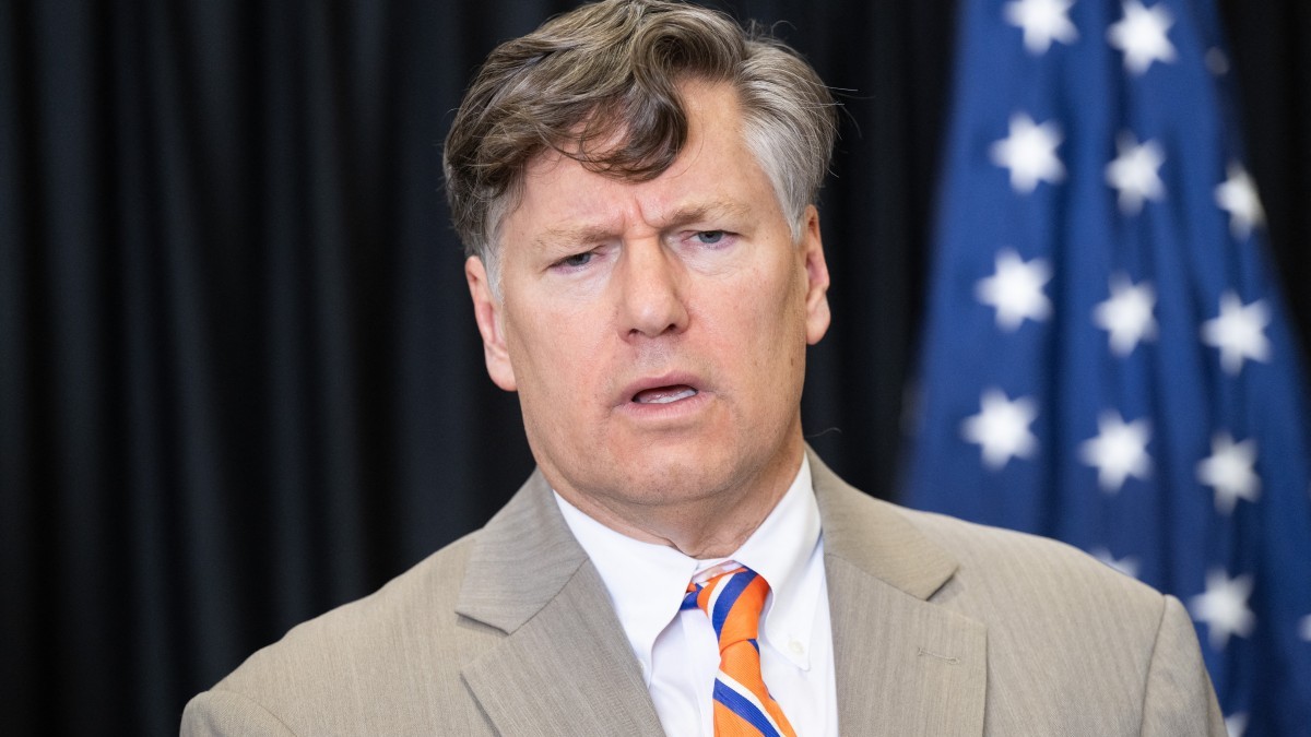 U.S. Deputy Secretary of State Christopher Landau speaks to the press after welcoming the first group of Afrikaners from South Africa arriving for resettlement at Washington Dulles International Airport in Dulles, Virginia, on May 12, 2025.