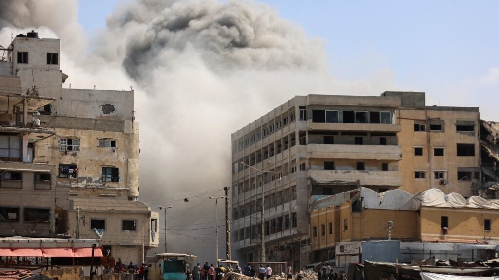 Smoke billows as Israeli airstrikes destroy the al-Ghafari tower in Gaza City on September 15, 2025.