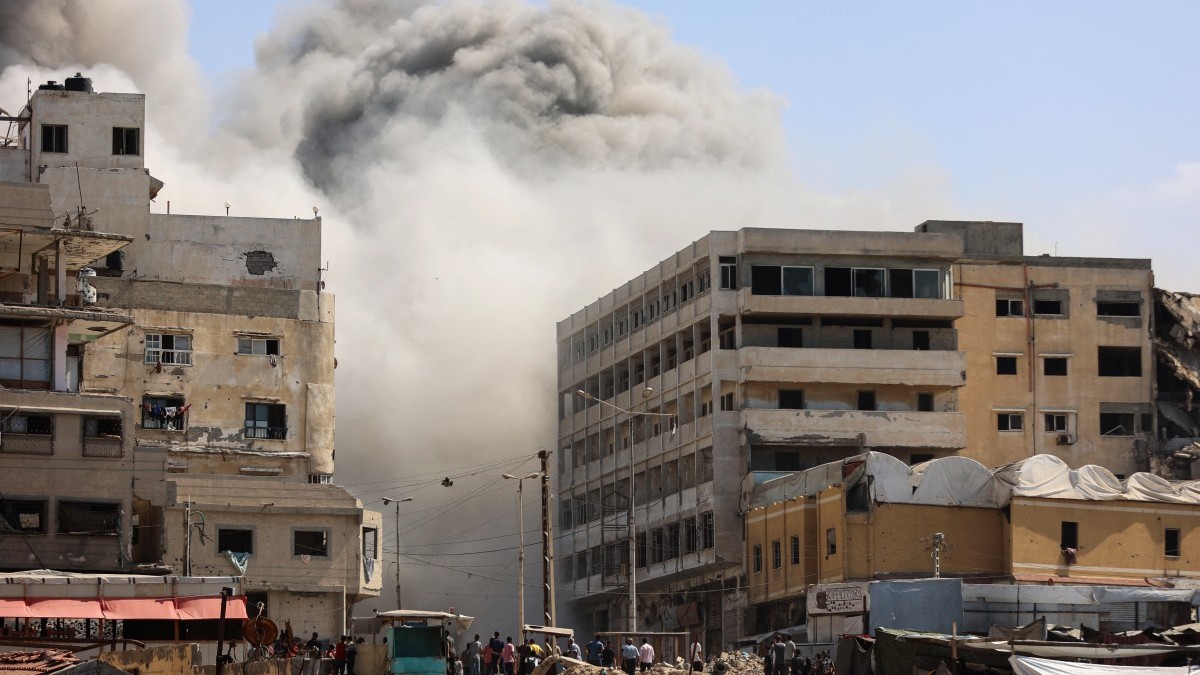Smoke billows as Israeli airstrikes destroy the al-Ghafari tower in Gaza City on September 15, 2025.