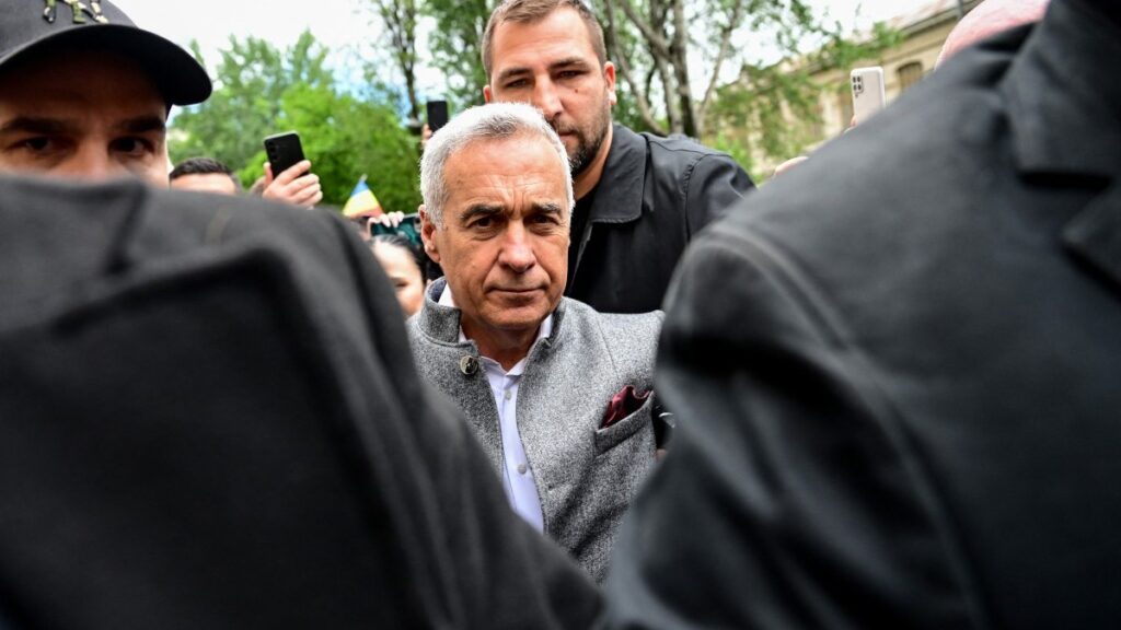 Călin Georgescu (C) arrives at the Prosecutor General's Office sourrounded by his bodyguards in Bucharest, Romania, on May 27, 2025.