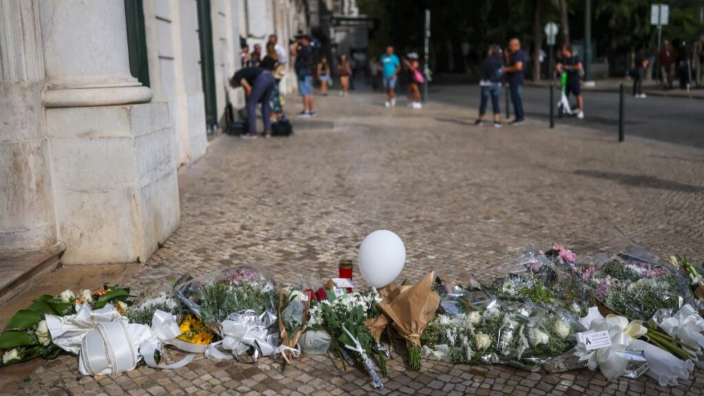 Flowers and tributes seen at the site of the Gloria funicular accident after the wreckage was removed in Lisbon on September 5, 2025.