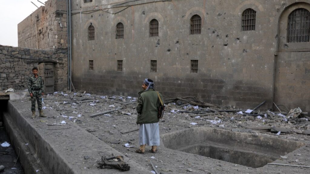 Men check the damages around to the National Museum building in Yemen's capital Sanaa following an Israeli airstrike the previous day, on September 11, 2025.