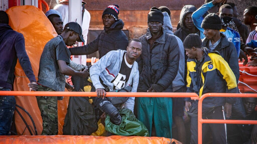 Migrants disembark after being rescued at sea by a Spanish Salvamento Maritimo (Sea Search and Rescue agency) vessel, at La Restinga port on the Canary island of El Hierro, on December 3, 2024.