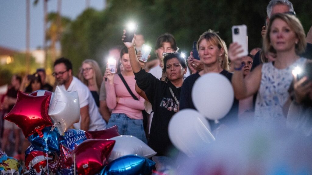 People at a makeshift memorial for conservative activist and Turning Point USA co-founder Charlie Kirk outside of their headquarters in Phoenix, Arizona, on September 20, 2025