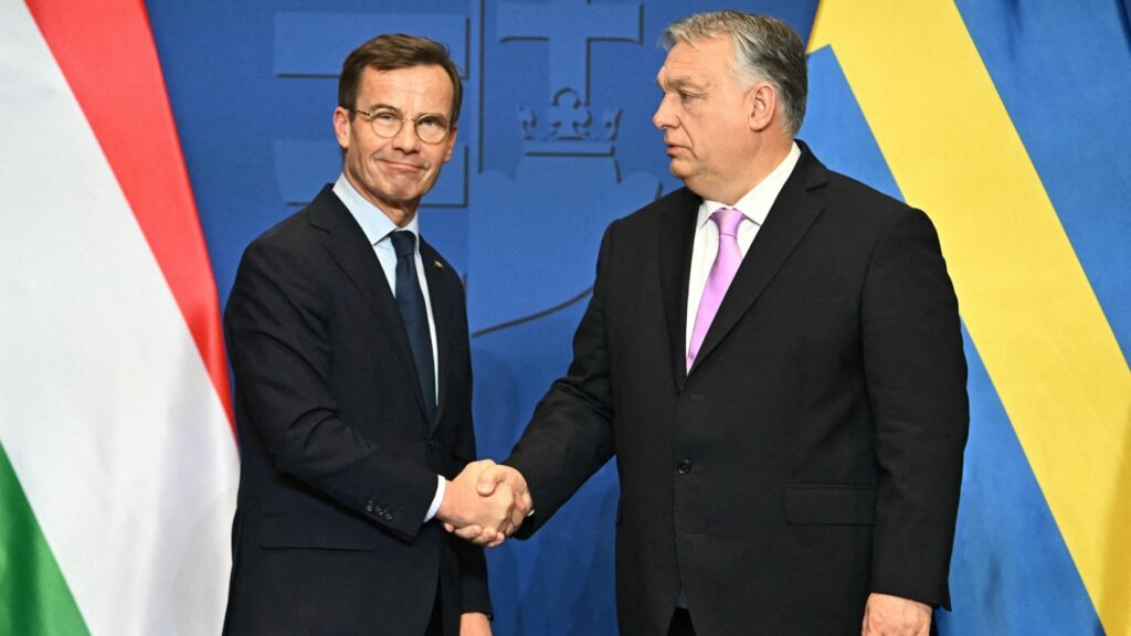Swedish Prime Minister Ulf Kristersson (L) and his Hungarian counterpart and host Viktor Orbán shake hands after a joint press conference in the Prime Minister’s office in Budapest, Hungary, on February 23, 2024.