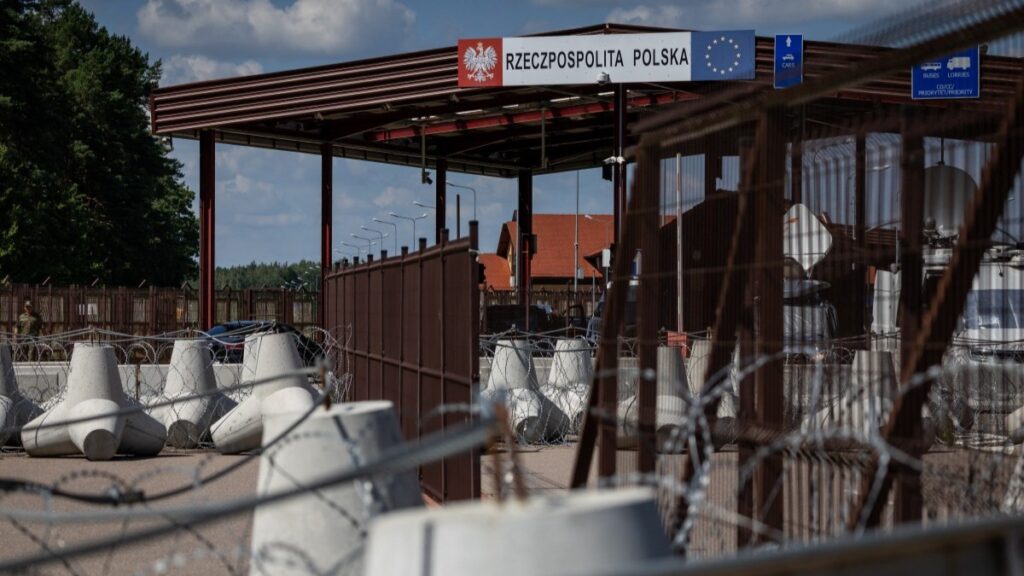 A sign reads “Republic of Poland” at the border crossing of the Polish-Belarusian country border with barbed wire and a fence in Polowce-Pieszczatka, Poland on July 21, 2025.