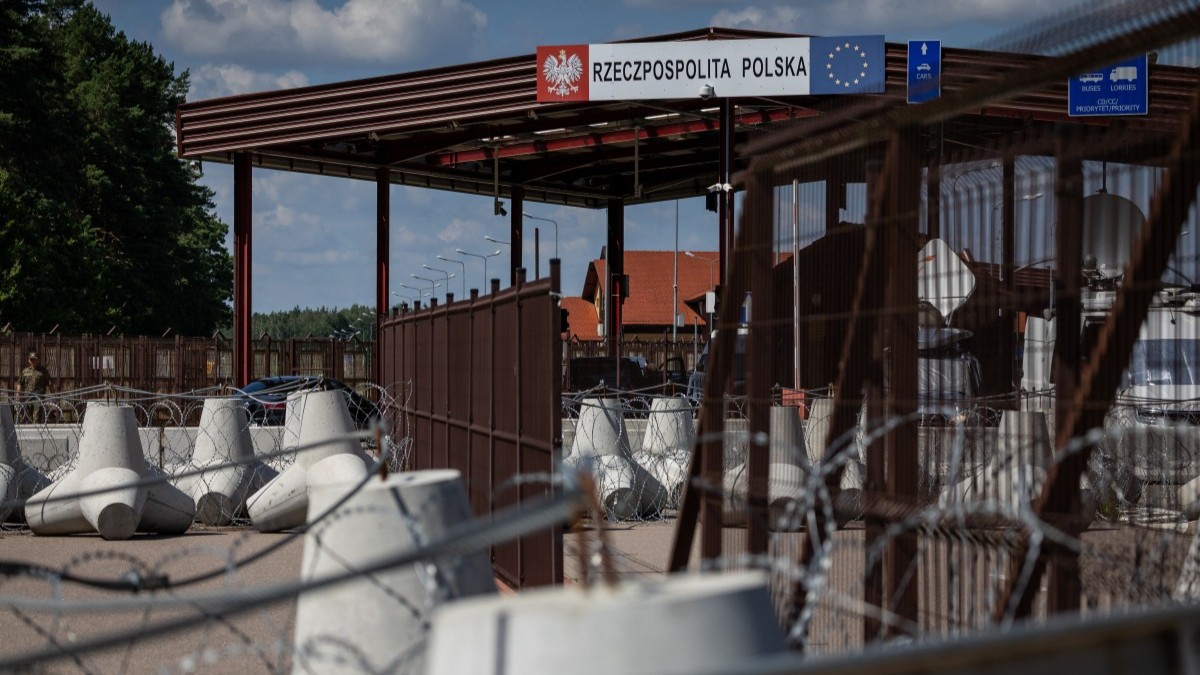 A sign reads “Republic of Poland” at the border crossing of the Polish-Belarusian country border with barbed wire and a fence in Polowce-Pieszczatka, Poland on July 21, 2025.