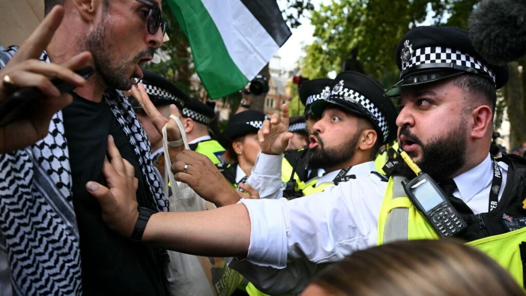 A police officer pushes back a protestor at a ‘Lift The Ban’ demonstration in support of the proscribed group Palestine Action, calling for the recently imposed ban to be lifted, in Parliament Square, central London, on September 6, 2025.