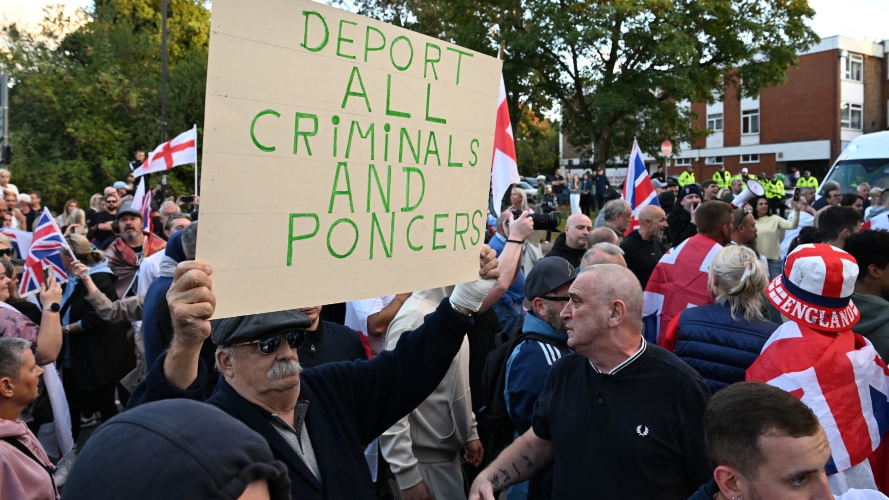 Protesters calling for the closure of The Bell Hotel which houses asylum seekers gather outside the council offices in Epping, England on August 31, 2025.