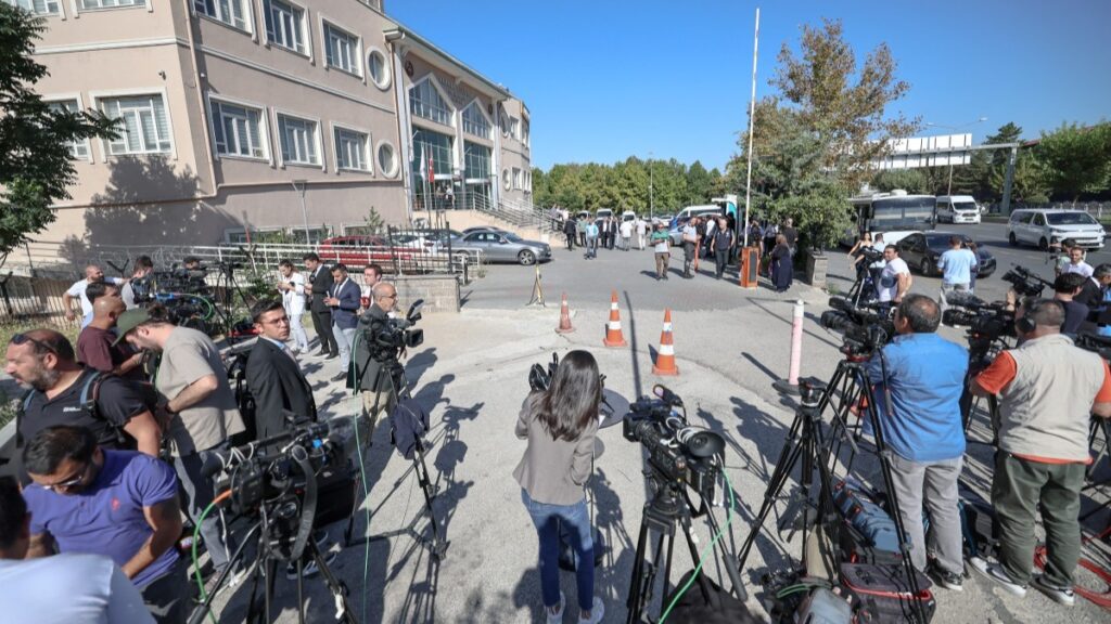 Journalists wait outside the court in Ankara, where a hearing on corruption charges could upend the leadership of Turkey's main opposition party, Republican People's Party (CHP), in Ankara on September 15, 2025.