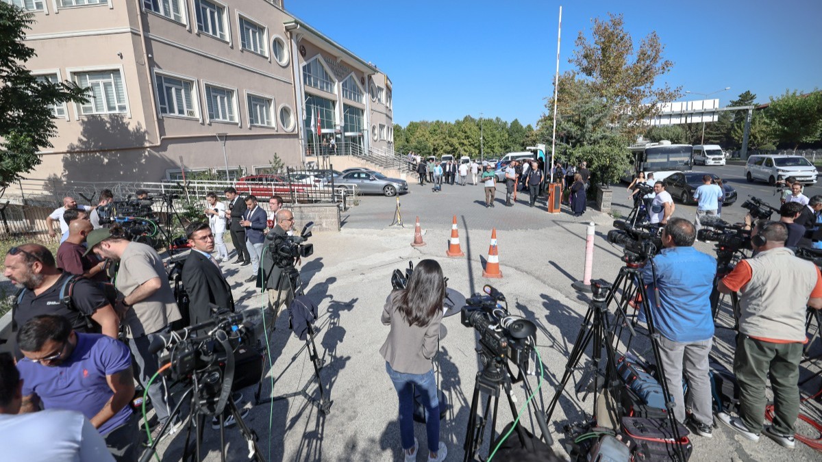 Journalists wait outside the court in Ankara, where a hearing on corruption charges could upend the leadership of Turkey's main opposition party, Republican People's Party (CHP), in Ankara on September 15, 2025.