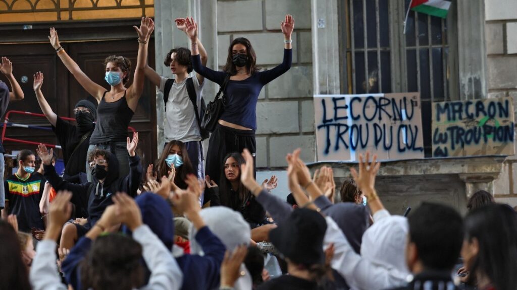 Students block the entrance to their school (lycée Thiers) in central Marseille, southeastern France, on September 18, 2025, during a day of nationwide strikes and protests called by unions over France's national budget.
