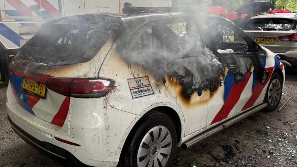 A torched police car following the anti-immigration protest in The Hague that turned violent on September 20, 2025