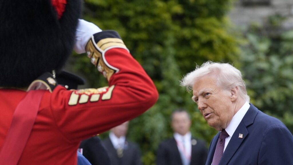 U.S. President Donald Trump greets members of the Armed forces after the Beating Retreat military ceremony, at Windsor Castle, in Windsor, on September 17, 2025, during the US President's second State Visit.