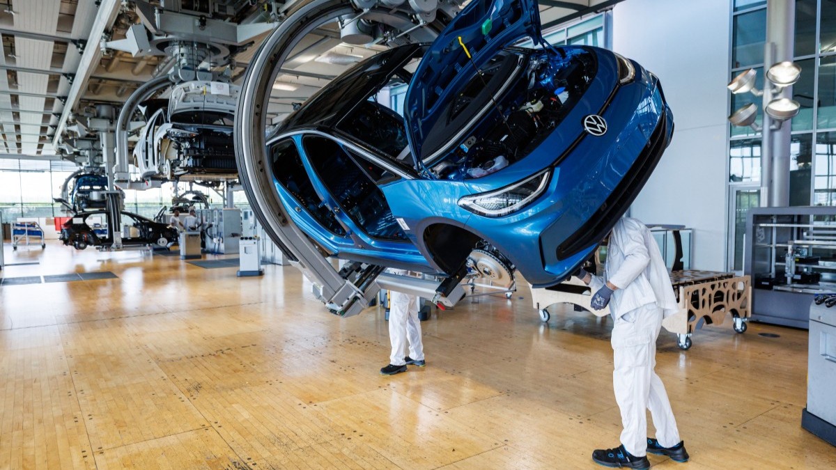 Employees work on the assembly line for the Volkswagen (VW) ID.3 electric car of German carmaker Volkswagen at a production site in Dresden on May 14, 2025.
