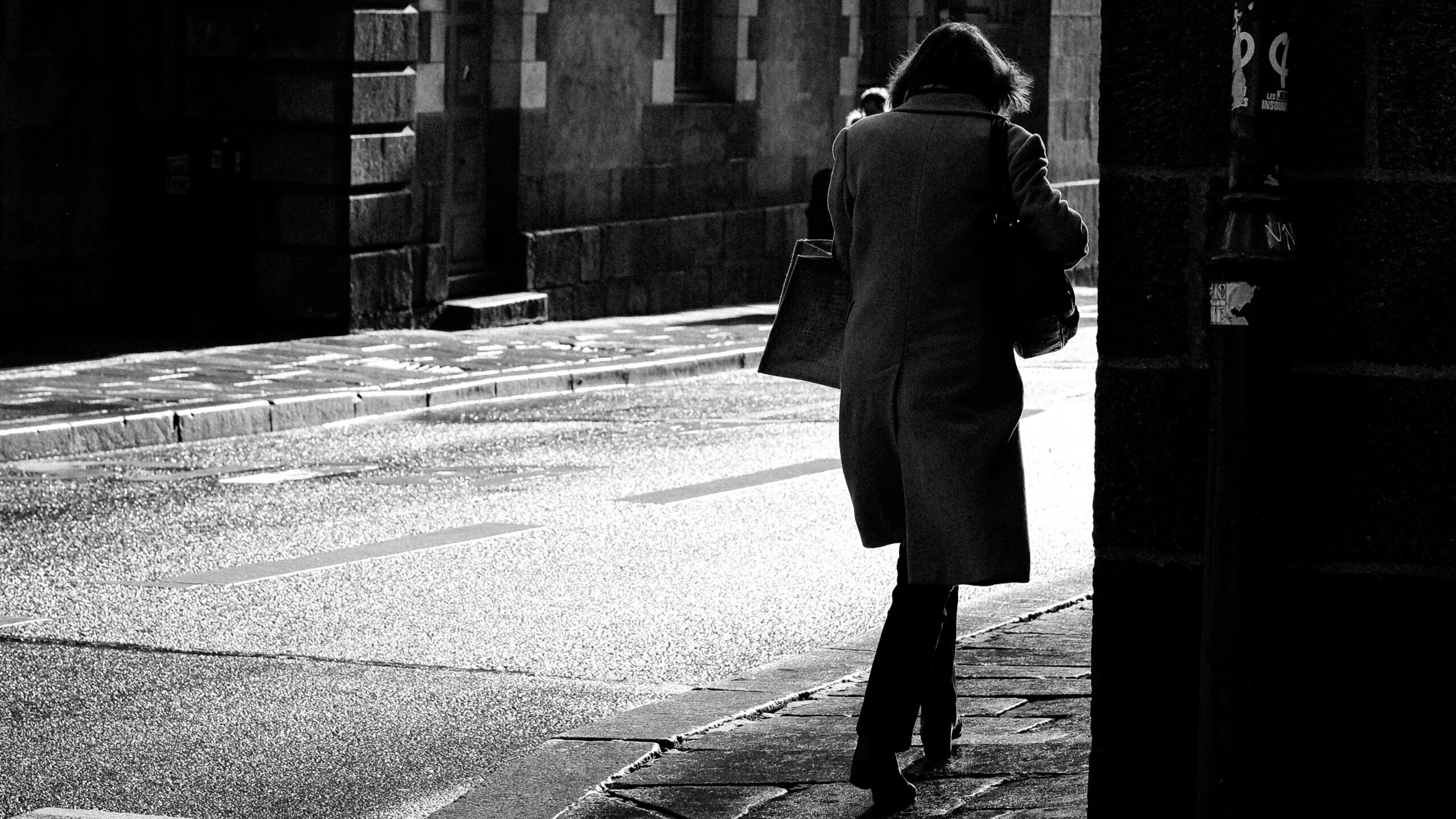 Woman on street alone (Unsplash)