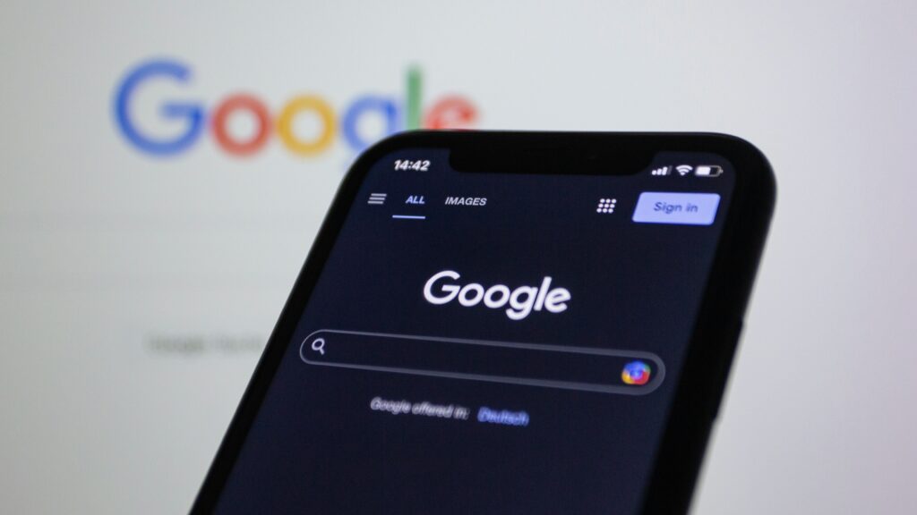 Cell phone with Google logo (Unsplash)