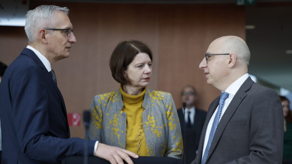 President of the Federal Intelligence Service (BND), Martin Jäger, Head of the Office for the Protection of the Constitution, Sinan Selen (R) and president of the Military Counterintelligence Service (MAD), Martina Rosenberg talk ahead a hearing by a Bundestag oversight committee in Berlin, on October 13, 2025.