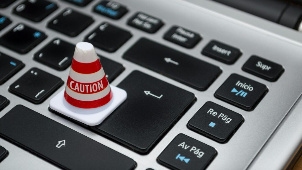 Keyboard with caution cone (illustration Digital Services Act)