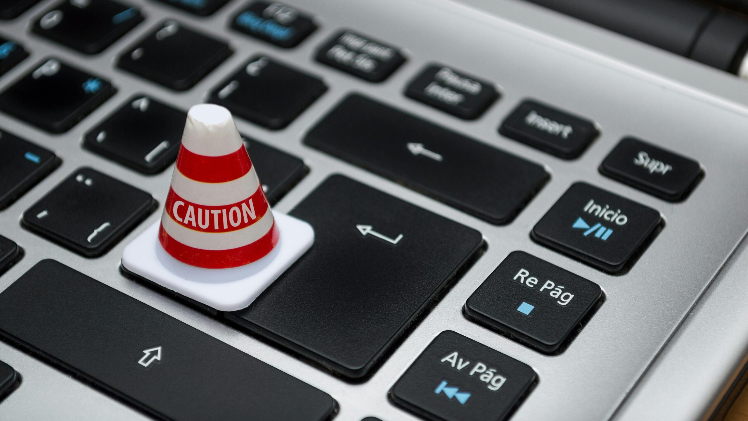 Keyboard with caution cone (illustration Digital Services Act)