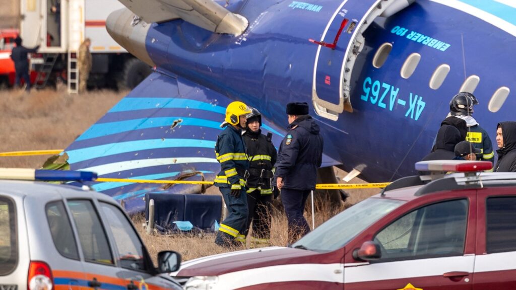 Emergency specialists work at the crash site of an Azerbaijan Airlines passenger jet near the western Kazakh city of Aktau on December 25, 2024.