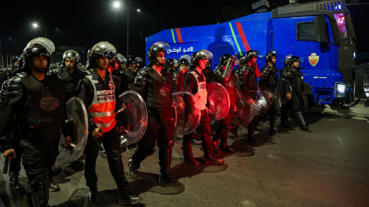Policemen guard a street during a youth-led demonstration demanding reforms in the healthcare and education sectors in Salé on October 1, 2025.