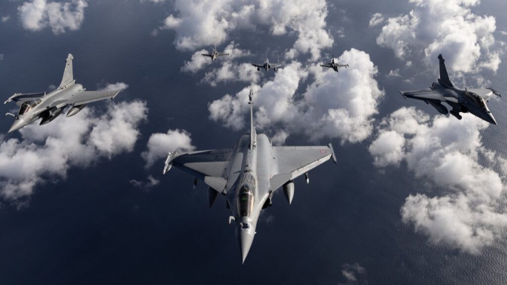 Two France air force Rafale fighter jets, a France air force Rafale B and (Back) two Greece air force fighter jets F16 (L and R) and a France air force Mirage 2000 D fly fly over the southwestern coasts of France on September 26, 2025, as part of the Volfa 2025 national inter-allied and inter-service drills.